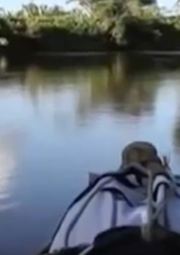 A kayak glides through water