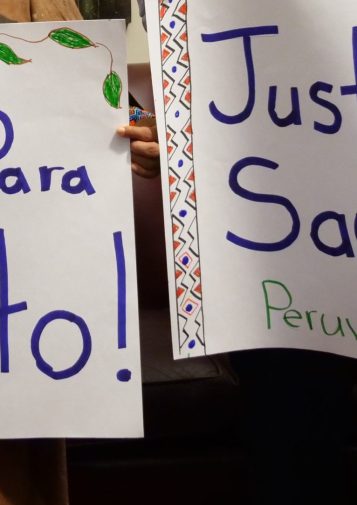 A pair of handmade banners reading 