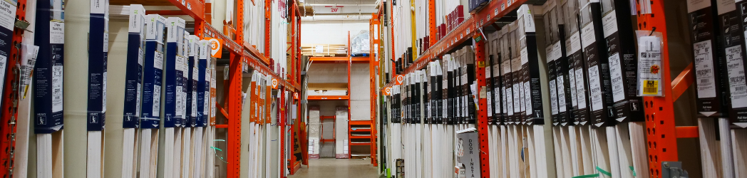 Rows of doors for sale framed by orange metal