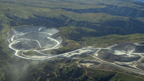 An aerial view of a mine scarring a landscape