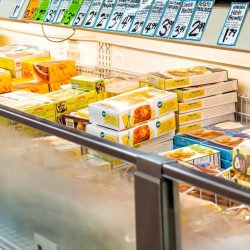 An array of frozen foods in an open refrigerator