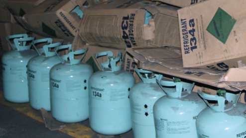 A row of refrigerant containers and boxes
