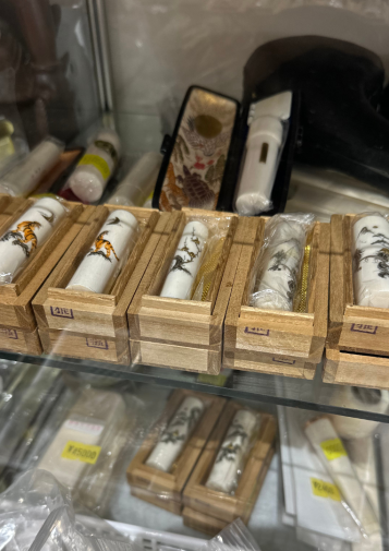 A row of ivory hanko decorated with tigers and dragons