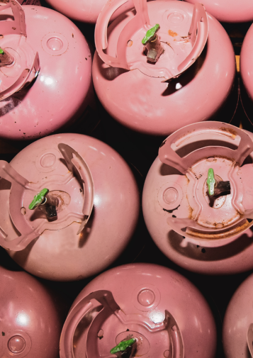Collection of pink R-410A refrigerant cylinders