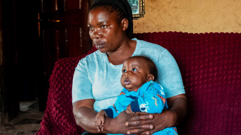 Concerned mother holding her baby in the DRC