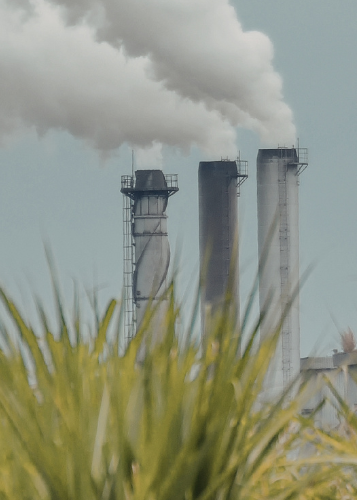 Emissions billow from a factory