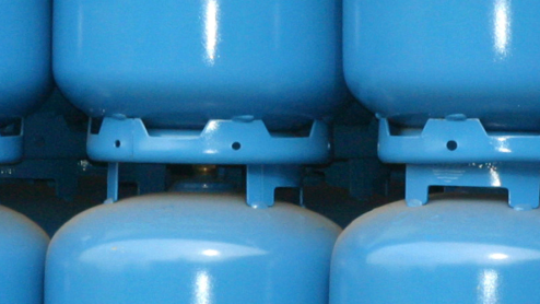 Row of blue refrigerant containers